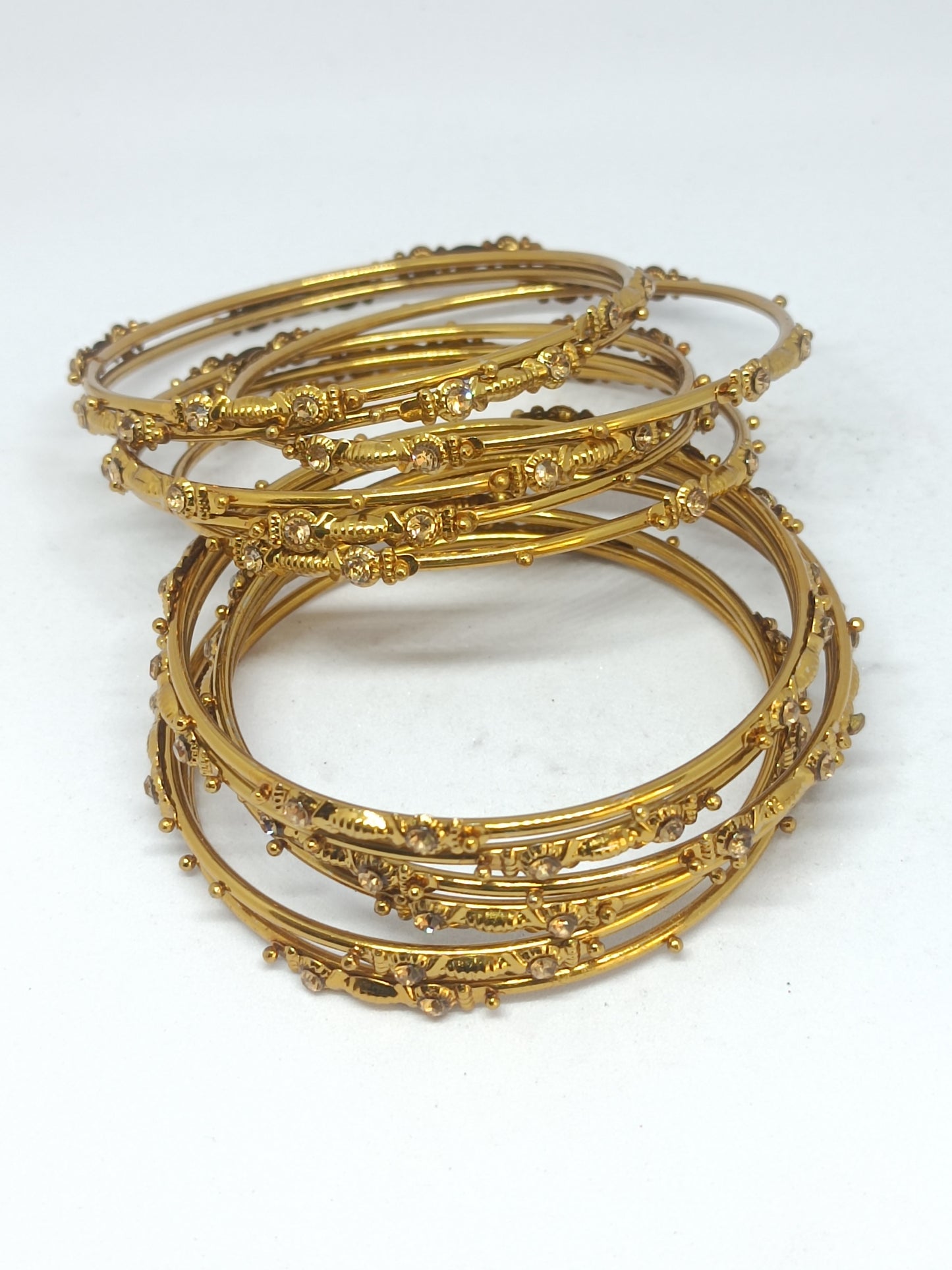 Set of 12 Elegant Gold-Tone Layered Designer Bangles with Stone Accents
