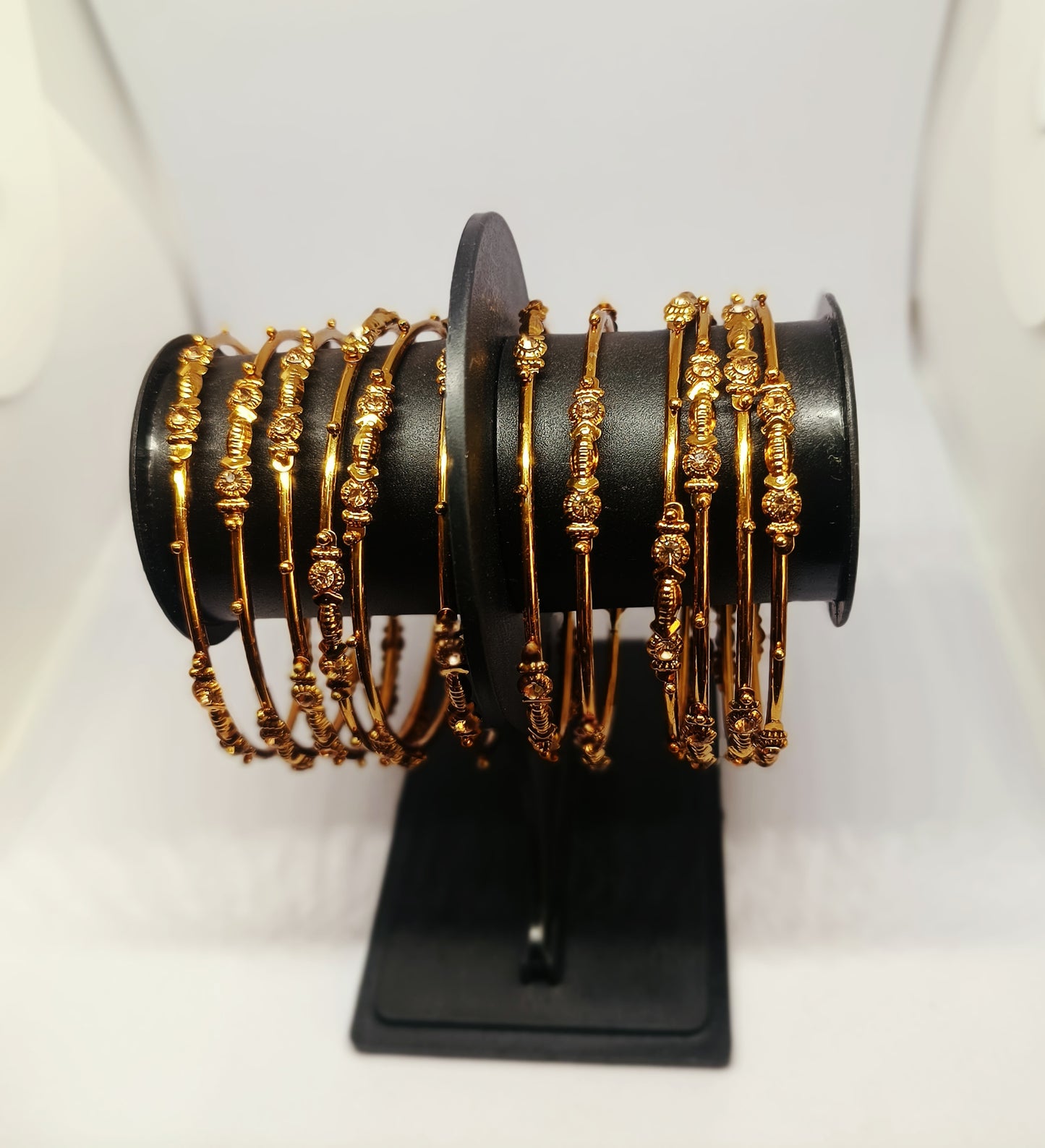 Set of 12 Elegant Gold-Tone Layered Designer Bangles with Stone Accents
