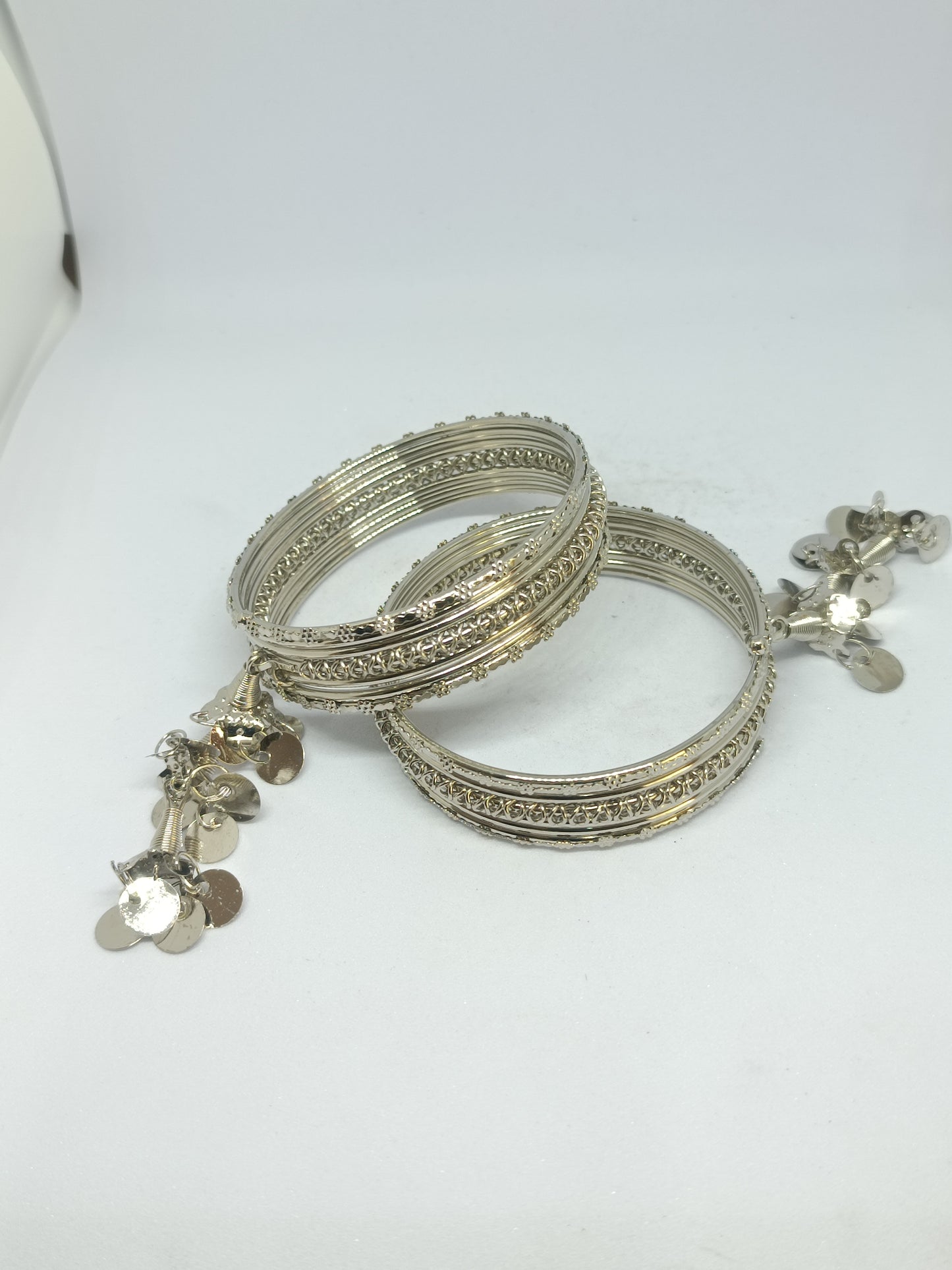 Pair of Elegant Oxidised Layered Bangle Set with Intricate Detailing & Dangling Charms