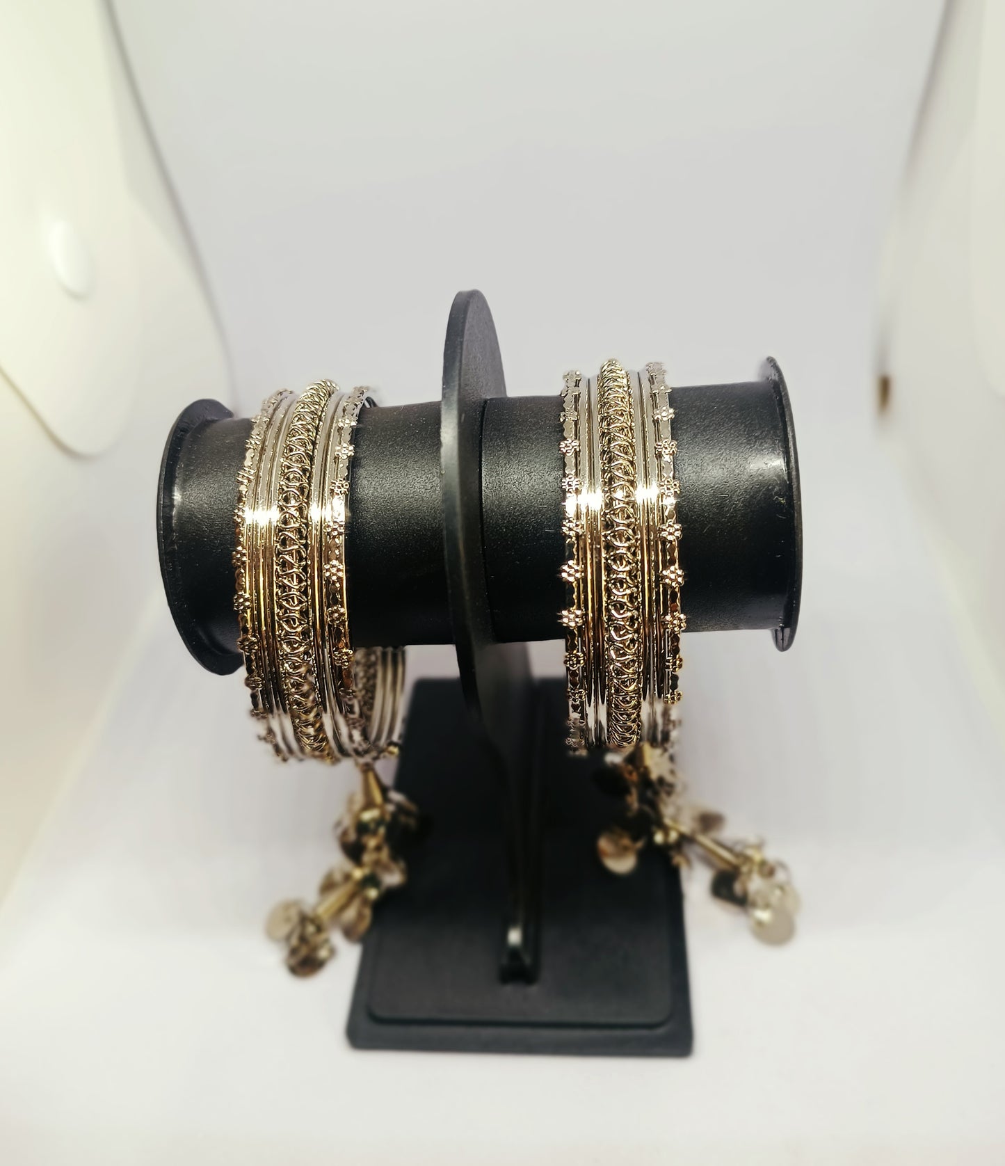 Pair of Elegant Oxidised Layered Bangle Set with Intricate Detailing & Dangling Charms