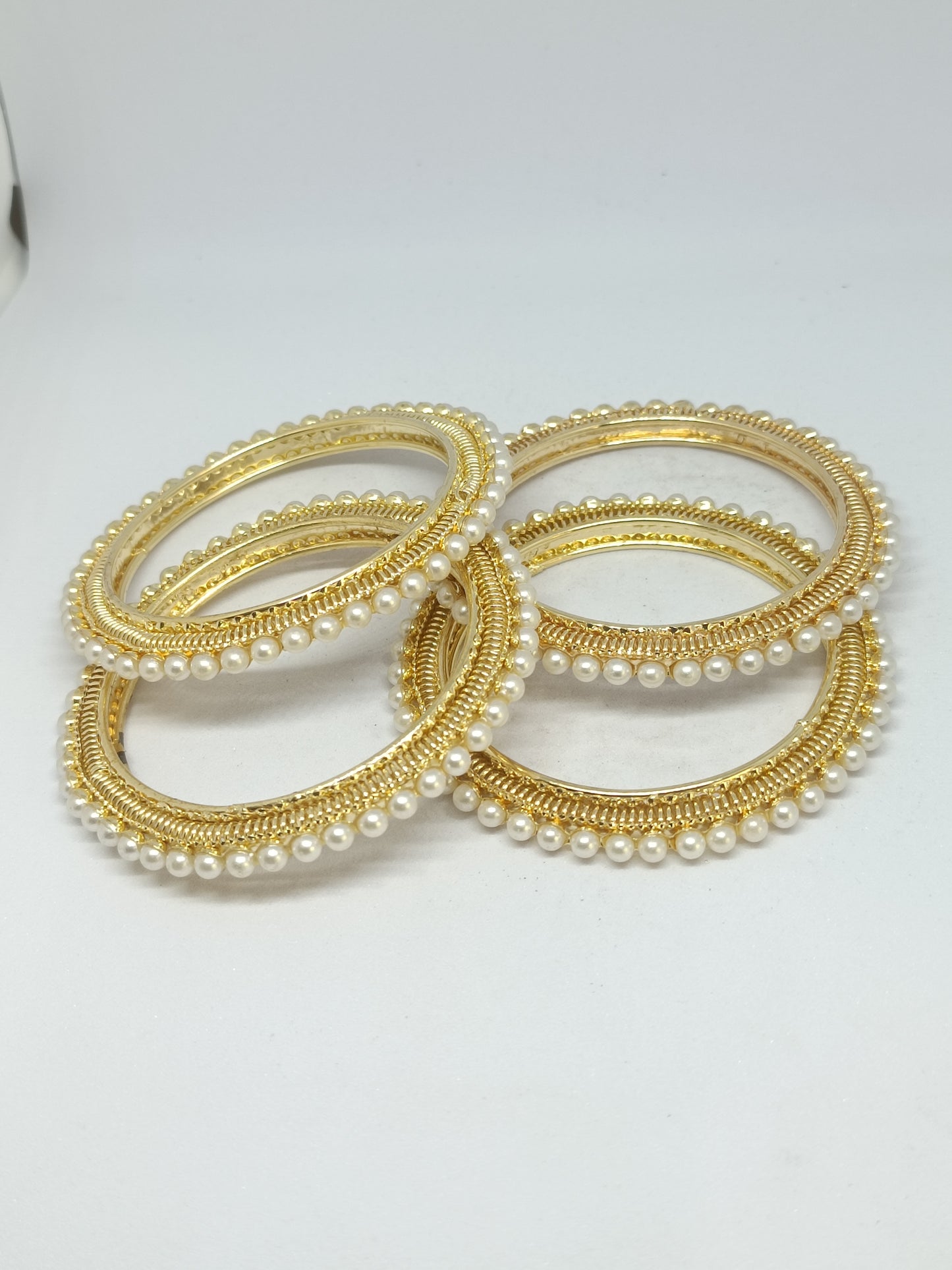 Gold plated pearl designer bangles set