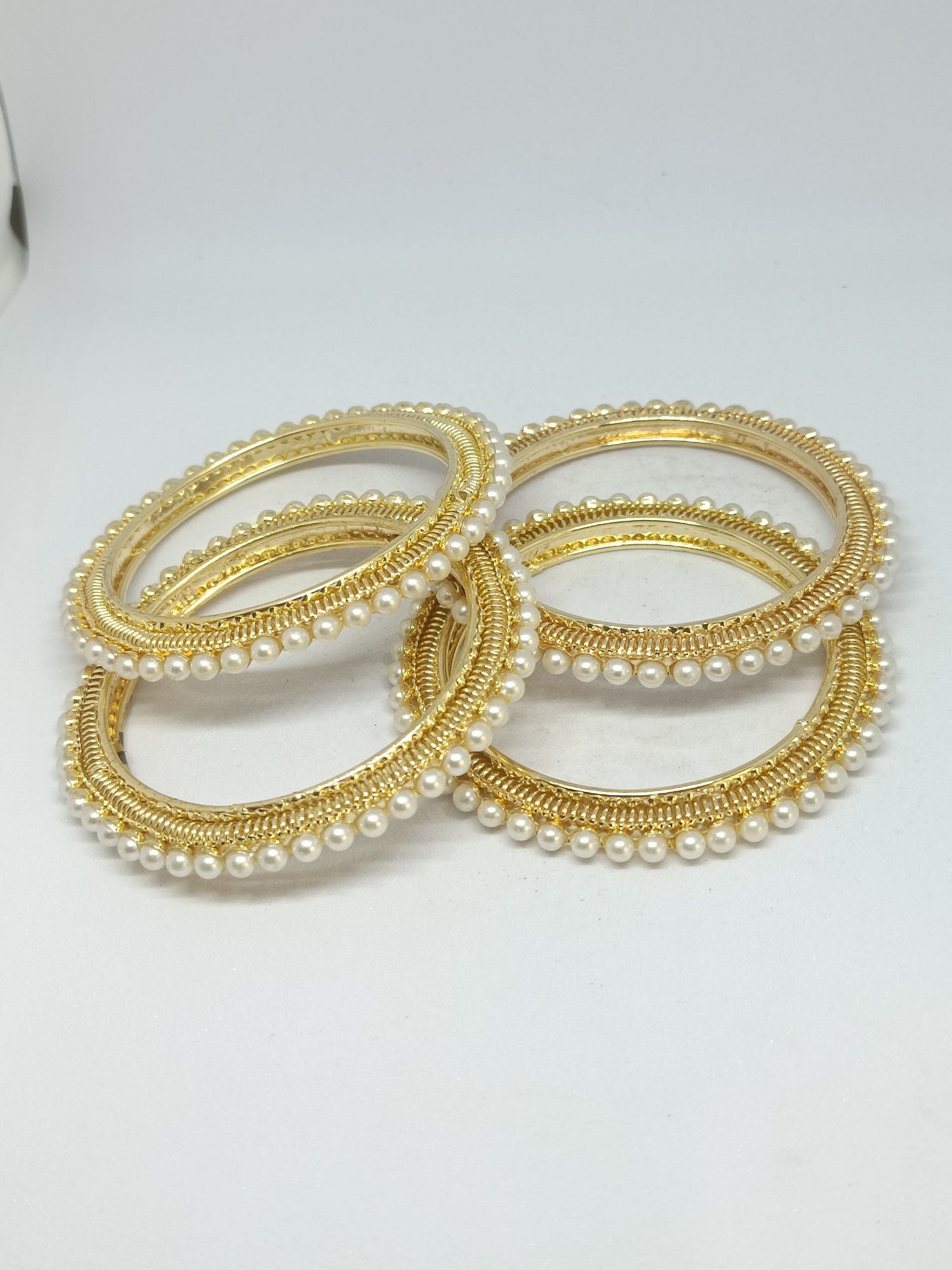 Gold plated pearl designer bangles set