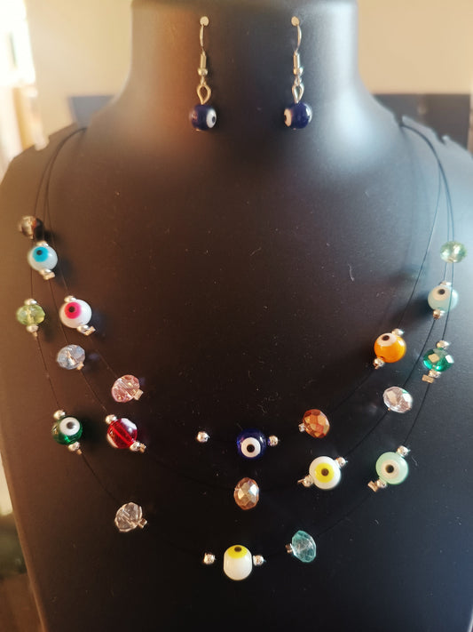 A three layered evil eye colorful beads neckpiece with matching earrings displayed on a mannequin.