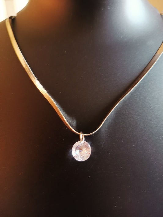 A silver-plated single-layered diamond neckpiece displayed on a mannequin.