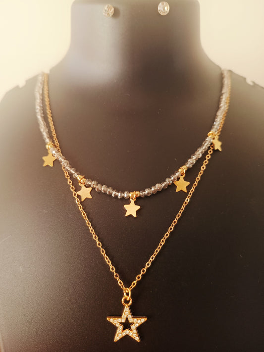 A gold-plated silver beads double-layered star neckpiece with ear-rings displayed on a mannequin bust.